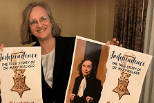Person holding book titled "Independence.